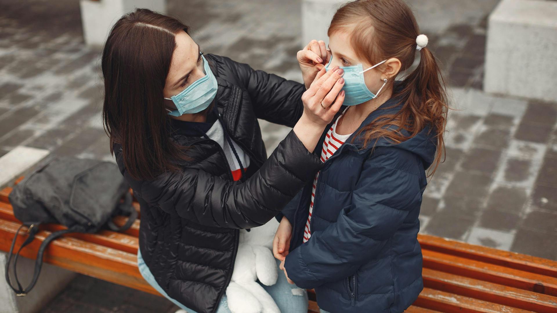 mum and daughter wearing a mask